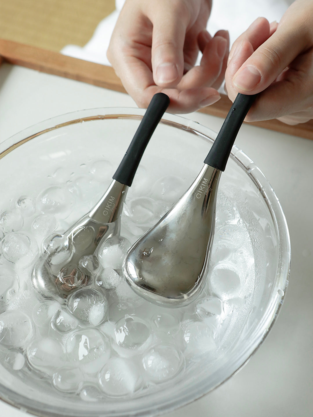 Hot and cold dual-use beauty device — black silicone handle