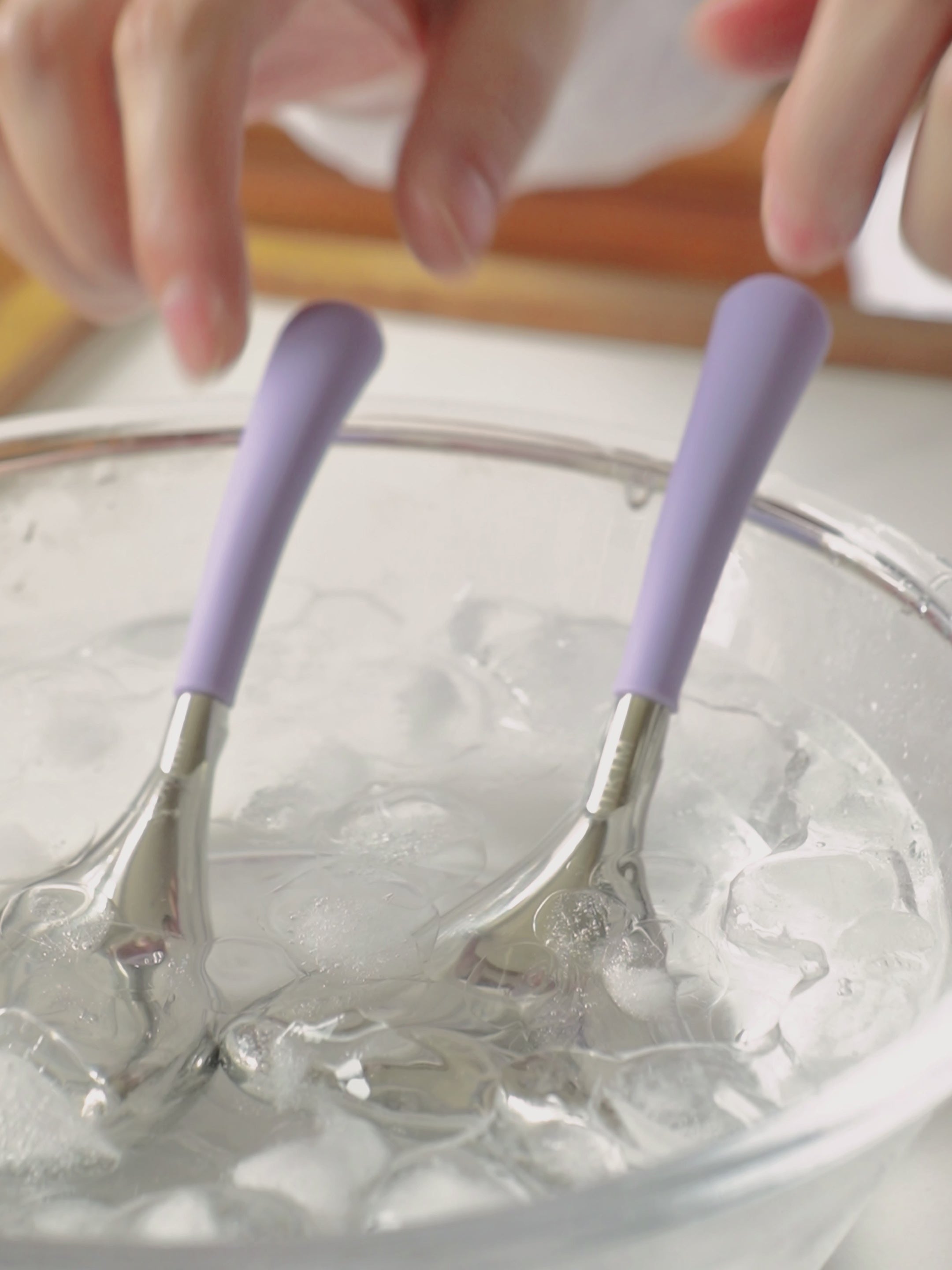 Hot and cold dual-use beauty device — purple silicone handle